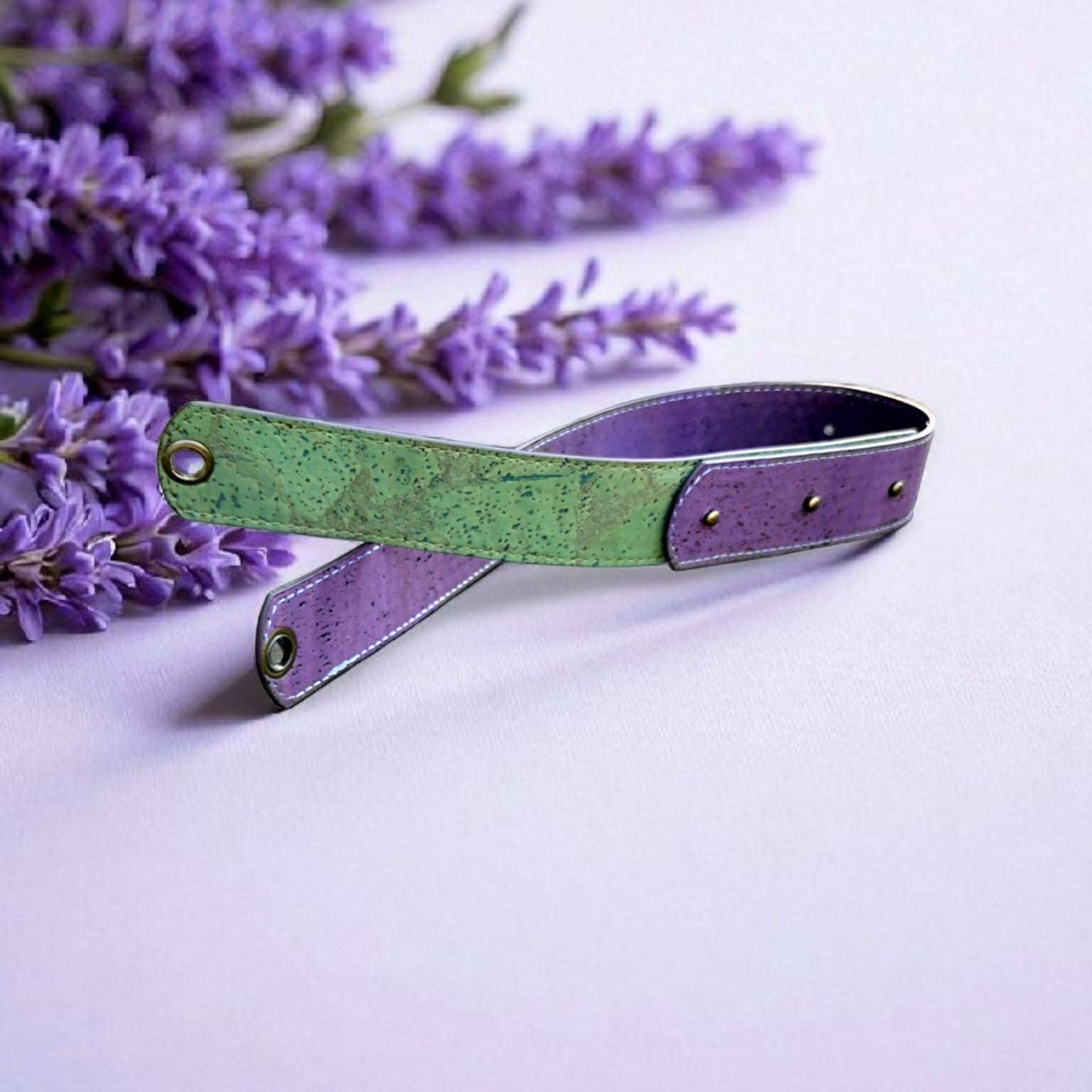 Green and purple leather strap with lavender flowers on a light background